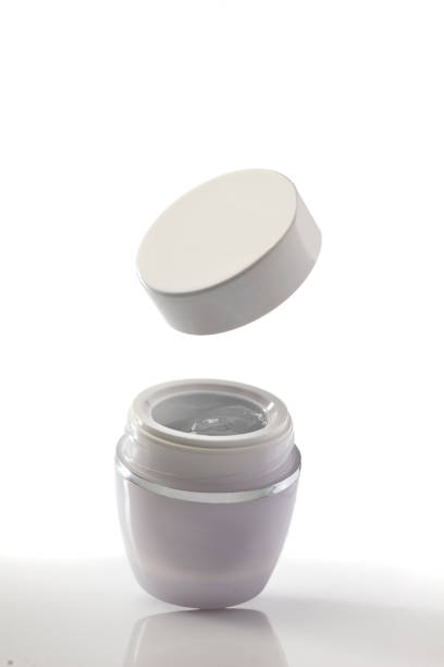 istock blank white jar with gel and flying lid on white background 901134538