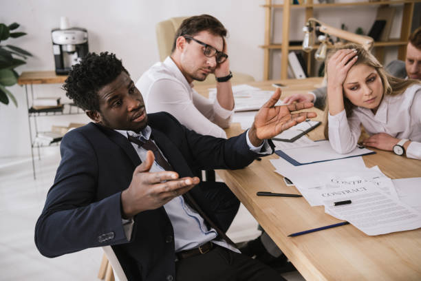 istock overworked buisness partners having conversation at office 901137790