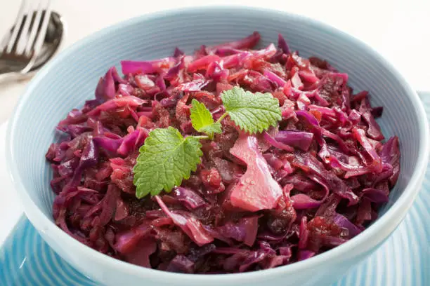 A delicious vegetable dish to eat with any rich meat, or sausage, spiced red cabbage with apple contains onion, nutmeg, allspice, balsamic vinegar and redcurrant jelly.