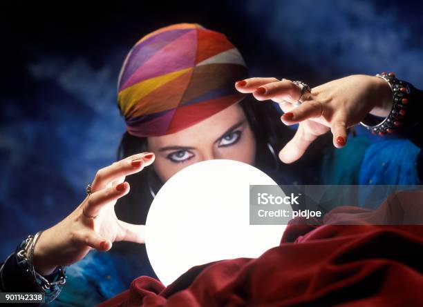 Mysterious Fortune Teller With Glowing Crystal Ball Stock Photo - Download Image Now