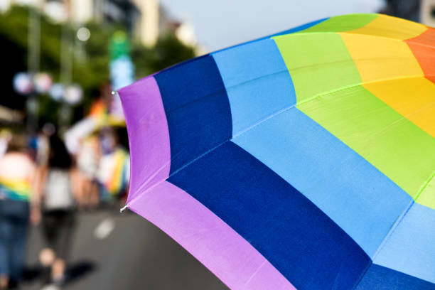 istock rainbow-patterned umbrella in a gay pride parade 901145762
