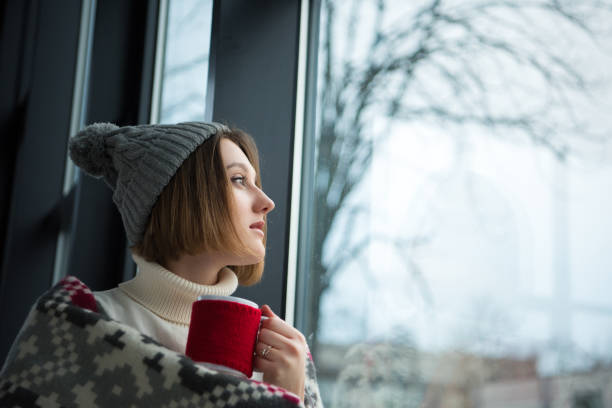istock girl holding red cup 901150374