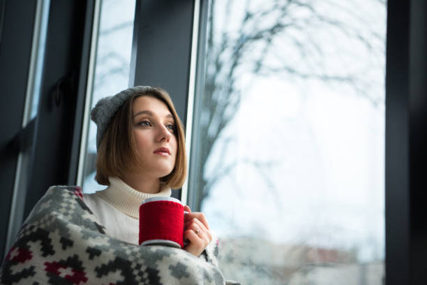 istock girl holding red cup 901152450