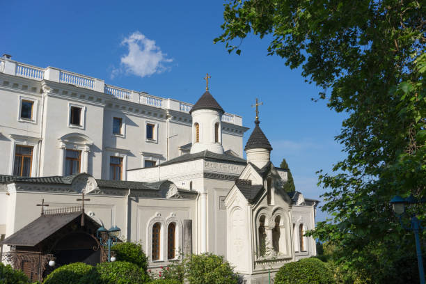 Yalta, Livadia. May 30, 2015. The temple part of the Vorontsov Palace among green trees and blue sky. Yalta, Livadia. May 30, 2015. The temple part of the Vorontsov Palace among green trees and blue sky. vorontsov palace stock pictures, royalty-free photos & images