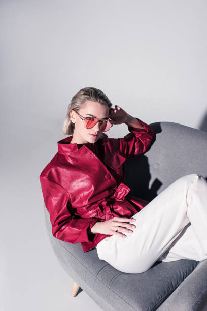 istock girl stylish on armchair 901168070