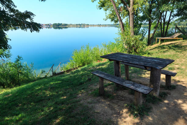 istock Camping pitch on summer lake calm beach 901173058