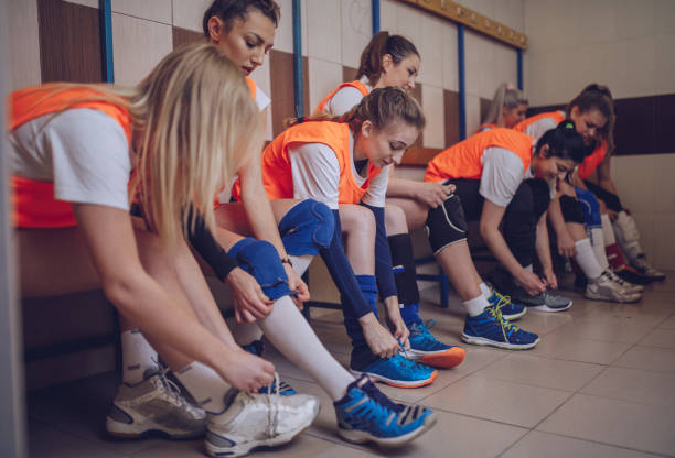 istock Volleyball team sitting in the locker room 901173884