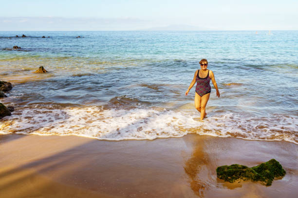 istock Senior Hispanic woman on Maui beach 901182010