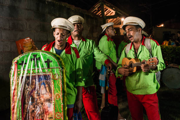 Valença (Rio de Janeiro), Brazil - January 01, 2018: Members of “Folia de Reis” during celebrations of Three Wise Men on the streets of Valença, RJ, Brazil. The “Folia de Reis”, portuguese for “Revelry of Kings” is a popular Brazilian tradition of folk Catholicism that involves a group of participants who, between Christmas and Epiphany, travel from place to place, singing and praising the birth of Christ.