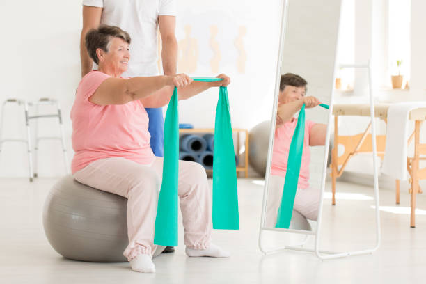 istock Elderly woman exercising shoulders muscles 901185752