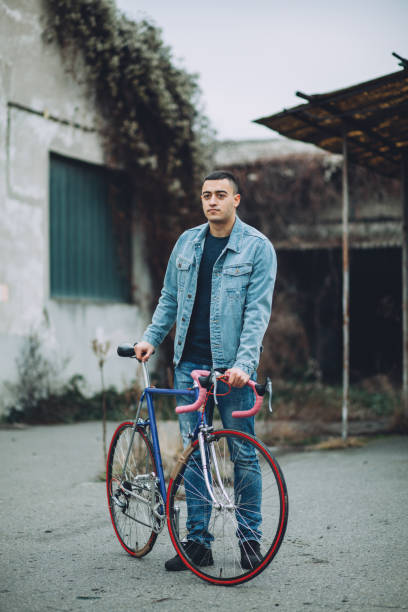istock Young hipster man with vintage bike 901186082