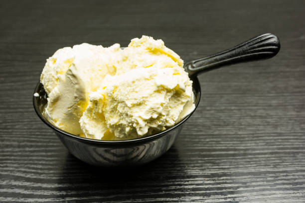 istock Vanilla ice cream in a black bowl. 901191540