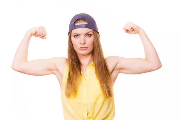 istock Woman casual style showing off muscles biceps 901191604