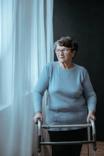 istock Senior woman with walker 901199126