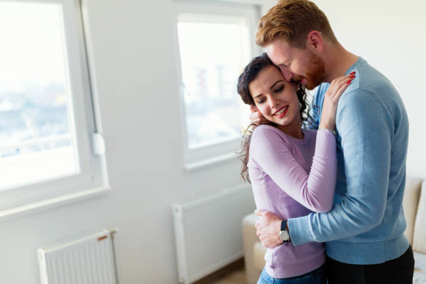 istock Young happy couple having romantic times at home 901199622