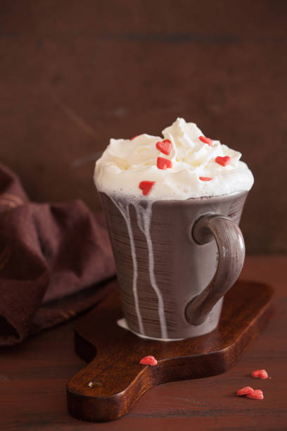 istock cup of coffee with whipped cream and red hearts 901202284
