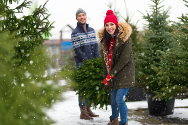 istock Couple buying Christmas tree 901203008