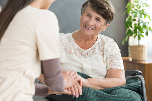 istock Smiling old lady and nurse 901206582