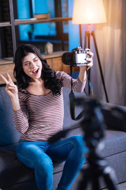 istock Happy delighted woman showing V sign 901208122