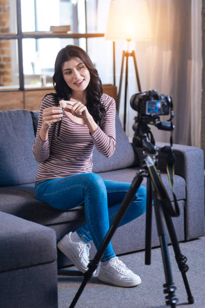 istock Delighted young woman recording a makeup lesson 901208598