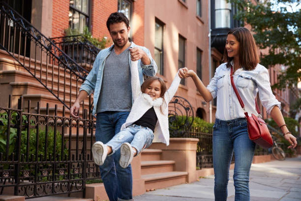 Family taking a walk down the street