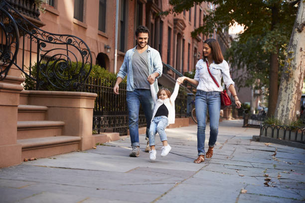 istock Family taking a walk down the street 901211898