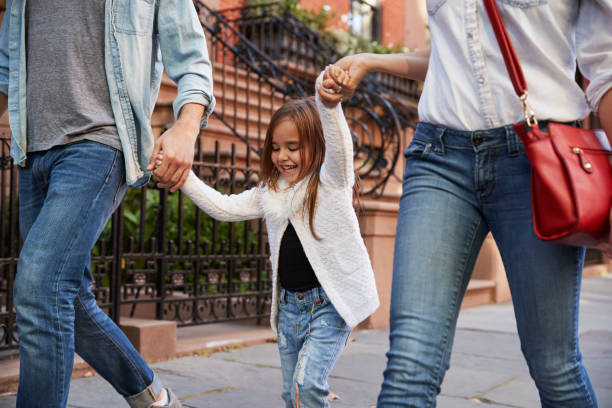 istock Family taking a walk down the street 901211930
