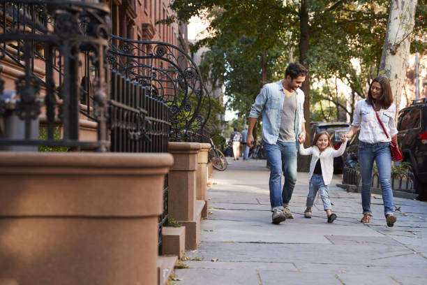 istock Family taking a walk down the street 901211938