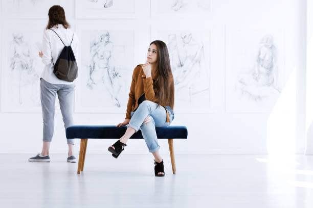 istock Woman contemplating art in gallery 901212218