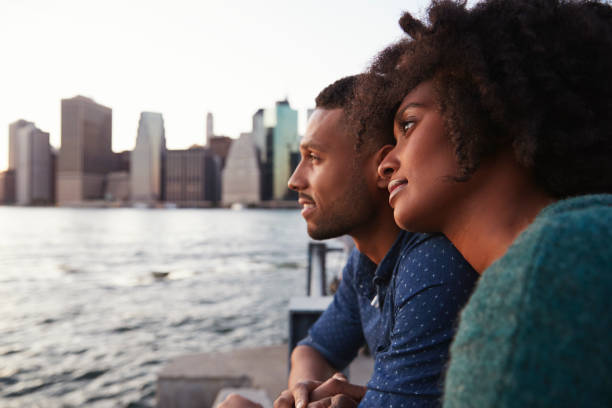 istock Young black couple standing on quayside, close up 901214996