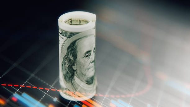 istock Rolled American One Hundred Banknote With Financial Graphic Elements Over Dark Background 901216358
