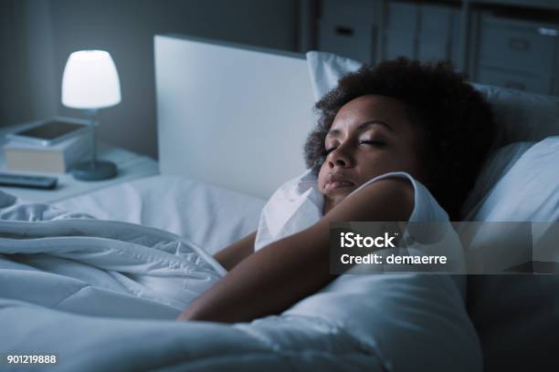 Woman Sleeping In Her Bed Stock Photo - Download Image Now - Sleeping, Night, One Woman Only