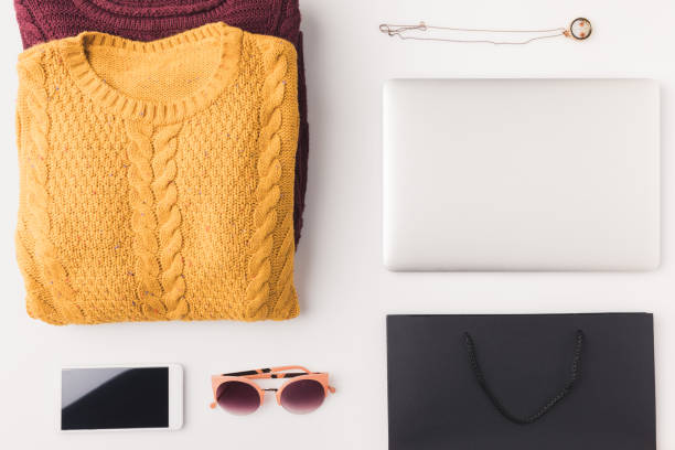 istock sweaters, laptop, smartphone and shopping bag 901219898