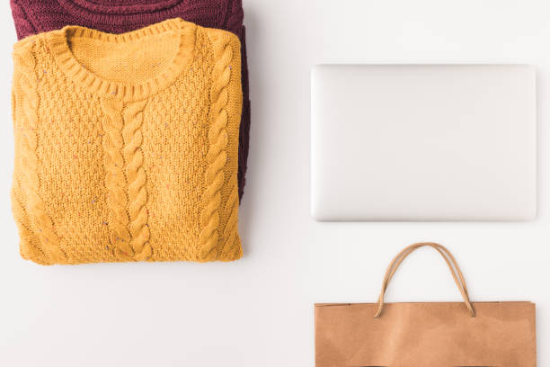 istock sweaters, laptop and shopping bag 901220614