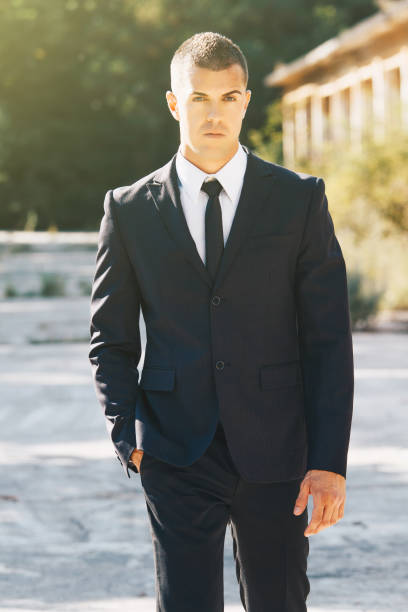 istock Awesome stylish men in elegant suite posing. Elegance and Luxury Man concept. 901224126