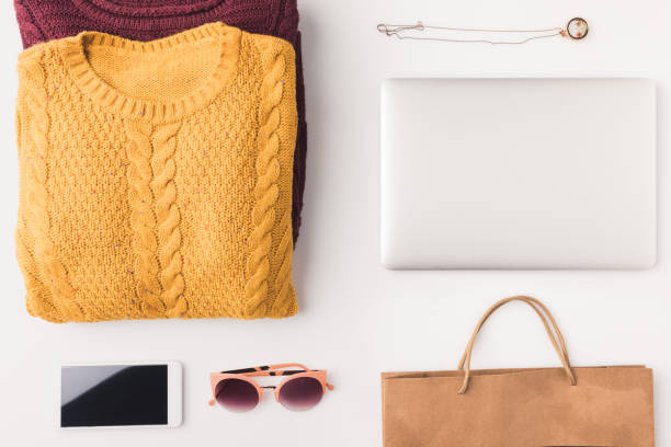istock sweaters, laptop, smartphone and shopping bag 901224160