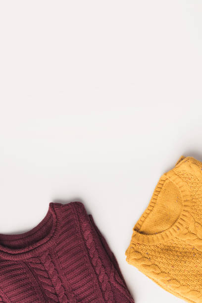 istock burgundy and yellow sweaters 901224216