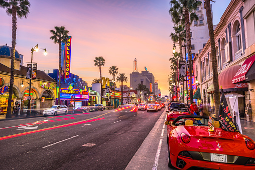 Los Angeles: Traffic on Hollywood Boulevard at dusk. The theater district is a famous tourist attraction.