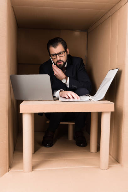 istock businessman with documents and laptop 901224292