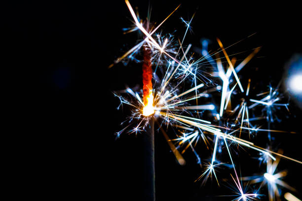 istock Burning sparkler isolated on black background blur 901228154