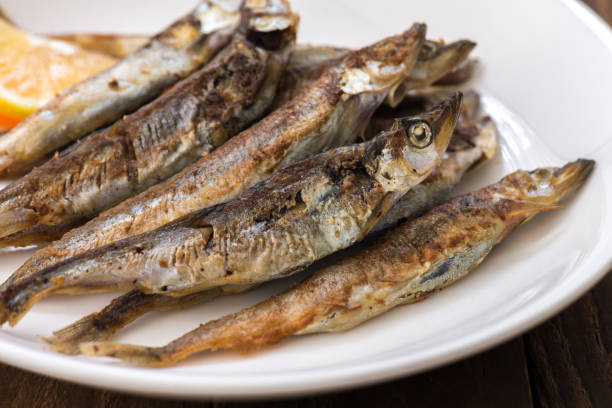 istock Grilled fish capelin or shishamo on white plate 901228740