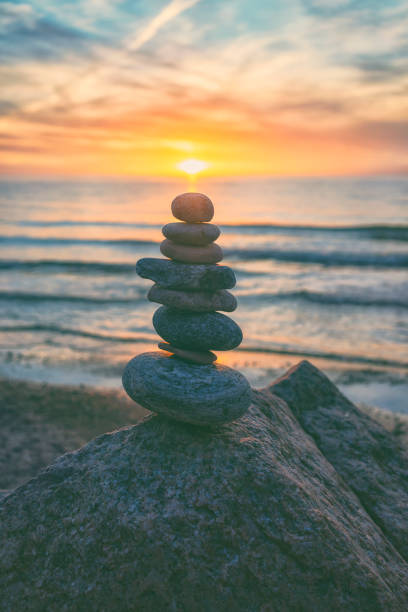 istock Pyramid of stones against the sunset 901228844