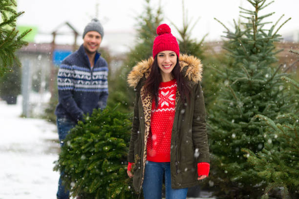 istock Couple buying Christmas tree 901231920