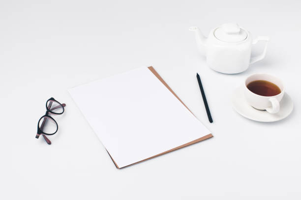istock blank paper with cup of tea 901231944