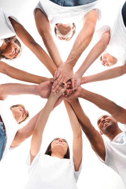 team bottom view of multiethnic group of volunteers making team gesture isolated on white the black womens expo stock pictures, royalty-free photos & images