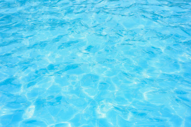 istock Ripple water in swimming pool with sun reflection 901232256