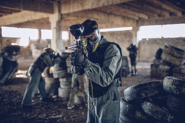 istock Aiming with a paintball gun 901235594