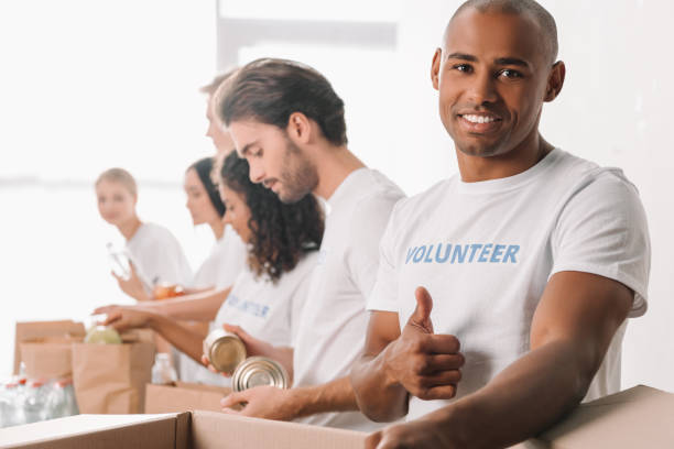istock volunteer showing thumb up 901235894