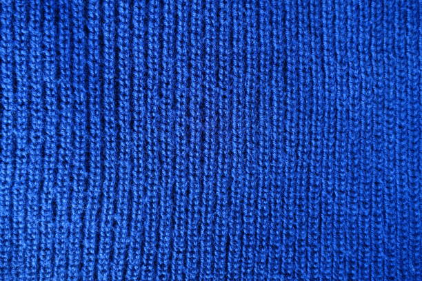 Handmade blue plain knit stitch fabric from above Handmade blue plain knit stitch fabric from above unprinted stock pictures, royalty-free photos & images