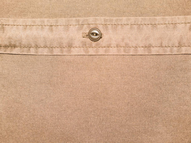istock plain brown cotton shirt texture with button in close up 901236564